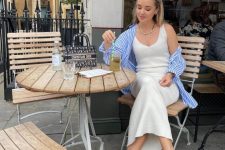 06 a creamy midi dress, a blue striped oversized shirt, white flipflops are perfect for a relaxed summer brunch