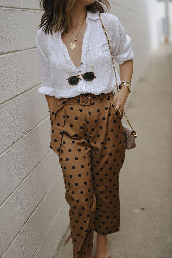 a simple and lovely summer outfit wiht a white linen shirt, rust-colored polka dot trousers and layered necklaces will fit an office