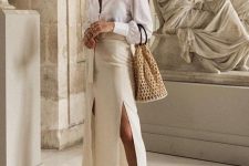 14 an elegant neutral look with a white button down, a tan midi skirt with two slits and a sash, nude mules and a bag