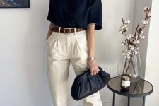 16 a basic work look with a black short sleeve button down, neutral high waisted pants, a brown belt and sliders and a black clutch