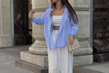 16 a cool casual outfit with a bra top, high waisted pants, creamy slides, a grey bag and an oversized blue shirt