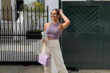 18 a lilac halter neckline crop top, creamy ripped jeans, white shoes, a lilac quilted bag are a great outfit for summer