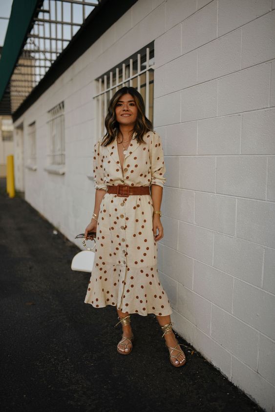 a beautiful neutral polka dot midi shirtdress with a brown belt, silver lace up shoes and a white bag with a ring handle