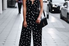 20 a black jumpsuit with spaghetti straps, neon yellow shoes and a black bag are a lovely and chic combo for summer
