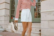 20 a red and white striped long sleeve top, white high waisted shorts, brown gladiator shoes and a straw bag