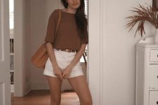 21 a rust-colored t-shirt, white denim shorts, a brown belt, amberslides and an amber bag are a lovely look for summer