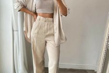 22 a neutral coordinating set – an oversized shirt and high waisted pants, a grey crop top and minimalist shoes for a brunch