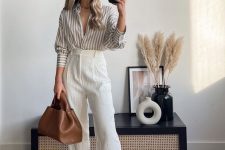 25 a simple and cool summer work look with a striped grey and white shirt, creamy high waisted pants, a brown bag are a lovely outfit to try
