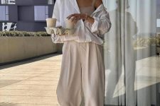 27 a tan crop top, tan wideleg pants, an oversized white shirt, creamy sandals and statement earrings for comfort everyday