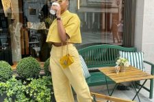 28 a total yellow brunch outfit with a linen cropped shirt, linen pants, gold sandals and a tiny yellow bag