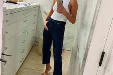 29 a white halter neckline top, navy cropped jeans, tan heeled sandals for a sexy and chic work look in summer