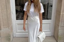 31 a white t-shirt, a creamy slip maxi skirt and a white bag are a very simple look done in all-neutral shades