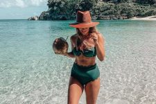 32 a chic green bikini with a bandeau top and a scallop edge high waisted bototm, a brown hat for the beach