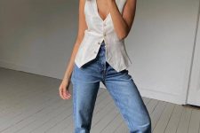 32 a white waistcoat, blue high waisted jeans, black minimalsit sandals and a basket bag are a lovely look with a casual feel