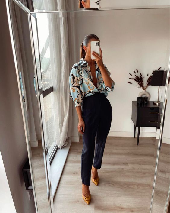 an elegant career look with a printed shirt, navy pants, yellow logo shoes is a great idea for spring to summer period or cold summer days