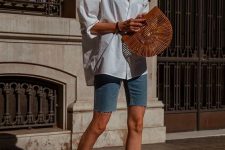 37 an oversized white shirt, blue denim biker shorts, black strappy heels and a wooden bag for a lovely summer outfit