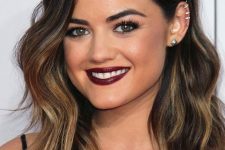 Lucy Hale wearing a black clavicut with gold and caramel balayage and waves looks fabulous, this is a gorgeous combo