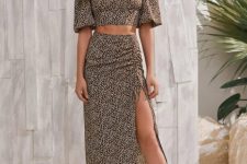 With golden necklace, printed midi skirt and black lace up heeled shoes
