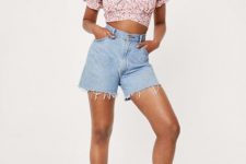 With light blue denim high-waisted shorts and white platform sandals