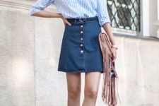 With white and light blue striped button down shirt, pale pink fringe clutch and white flat shoes