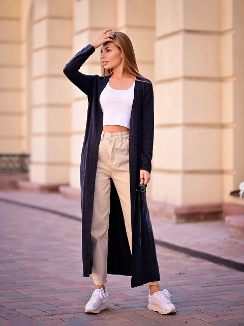 With white crop top, beige high-waisted pants and white sneakers