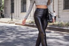 With white framed sunglasses, black leather high-waisted skinny pants, black leather clutch and white leather ankle boots