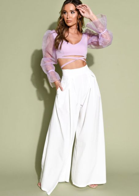 With white high-waisted palazzo trousers and white high heels