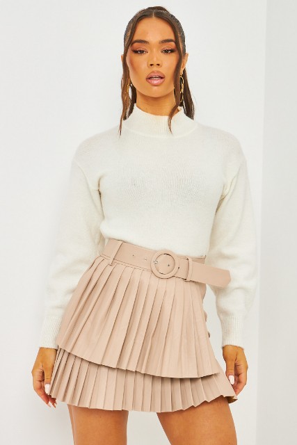 With white long sleeved sweater, golden earrings and beige leather belt