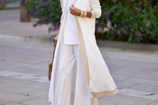 With white loose blouse, white and beige palazzo pants, platform sandals and brown bag