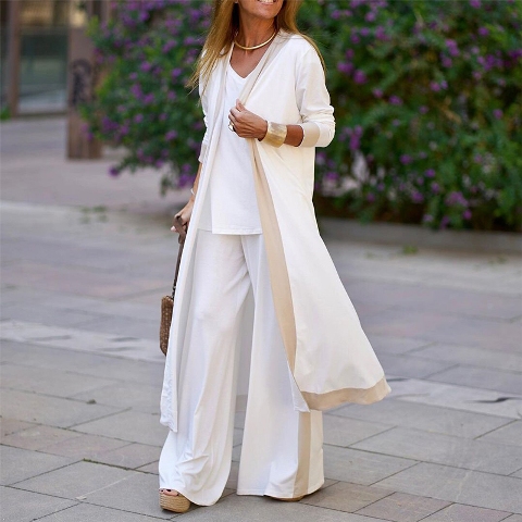 With white loose blouse, white and beige palazzo pants, platform sandals and brown bag