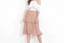 With white ruffled off the shoulder blouse and pale pink ankle strap heeled shoes