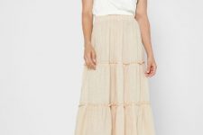With white sleeveless loose top and white leather heeled mules