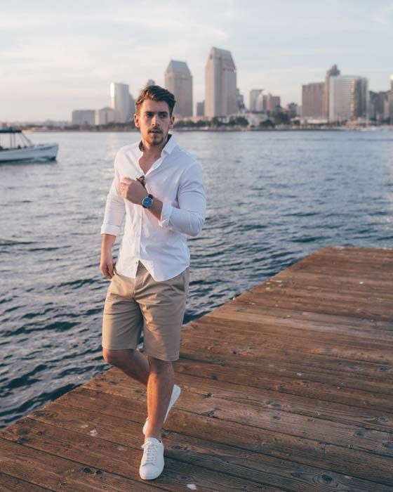 a casual summer date look with a white button down and tan shorts, white sneakers and a watch is a timeless idea that always works