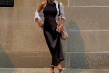 a chic look with a black halter neckline top, a slip midi skirt, lace up sandals, a white shirt and a neutral bag for summer