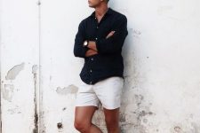 a contrasting summer outfit with a black linen shirt, neutral shorts, black birkenstocks and sunglasss is a cool idea for a date