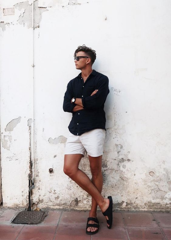 a contrasting summer outfit with a black linen shirt, neutral shorts, black birkenstocks and sunglasss is a cool idea for a date