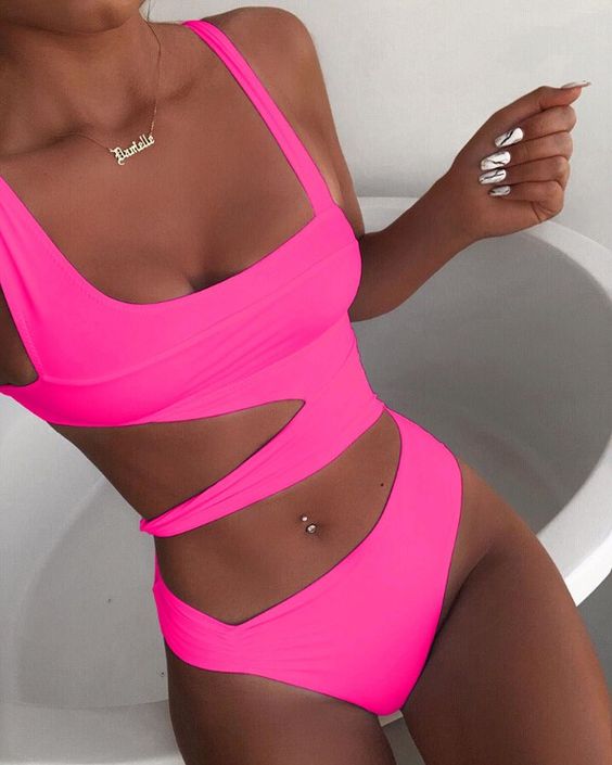 a cutout asymmetrical neon pink one piece swimsuit with a square neckline is a bold idea to rock at a beach party