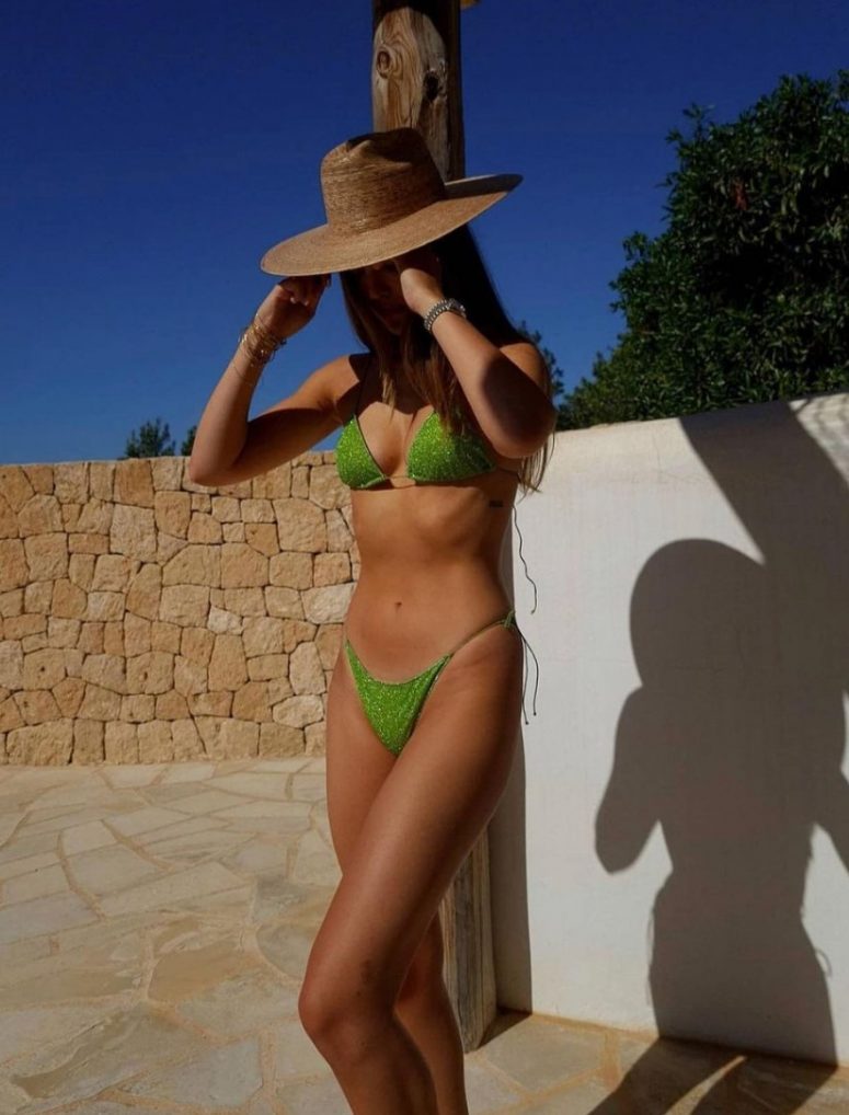 a neon green sparkle mini bikini paired with a straw hat will make your beach or beach party look unforgettable