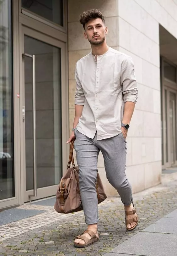 a neutral summer date look with a greyish mao shirt, grey skinny jeans, brown birkenstocks and a brown bag