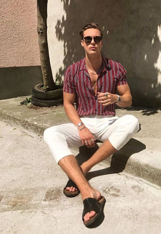 a red vertical striped shirt, white short pants, black slippers and layered necklaces for a chic and sexy summer date look