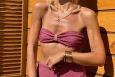a romantic mauve sparkle bikini with a bow bandeau top and a high waisted bottom plus gold accessories for a lovely look