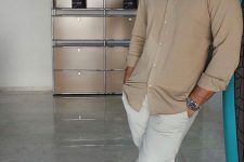 a simple and elegant summer date look of neutral pants, a tan shirt and matching tan birkenstocks is a perfect idea