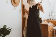 a simple total black summer look with  black sleeveless linen midi dress, black strappy platform sandals and a small bag