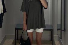 a simple workout look with an oversized graphite grey t-shirt, white biker shorts, white socks and grey trainers