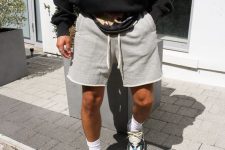 a sport outfit with a logo hoodie in black, grey shorts, white socks and bright trainers is a lovely idea for spring