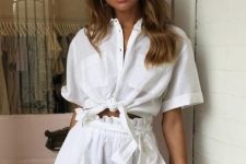 a stylish and simple linen set in white, with a knotted shirt and paperbag waist shorts is all you need for a hot summer
