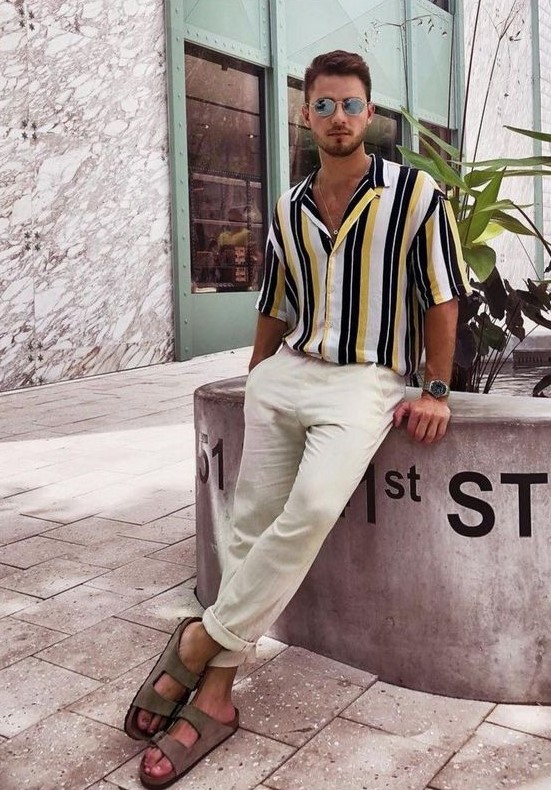 a summer date or beach date look with a vertical stripe short-sleeved shirt, neutral linen pants, grey birkenstocks is easy and comfortable