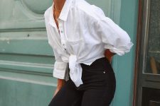 a white knotted shirt, black denim biker shoers, a brown tote for a comfortable monochromatic look in summer