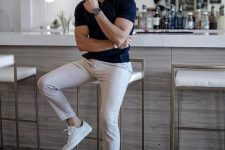 an elegant look with a navy polo shirt, neutral pants and white sneakers always works for a date that isn’t very relaxed