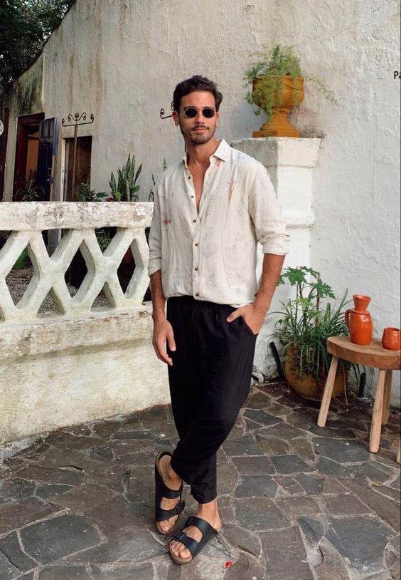 an elegant summer date look with a neutral printed button down, black trousers and black birkenstocks is easy to repeat